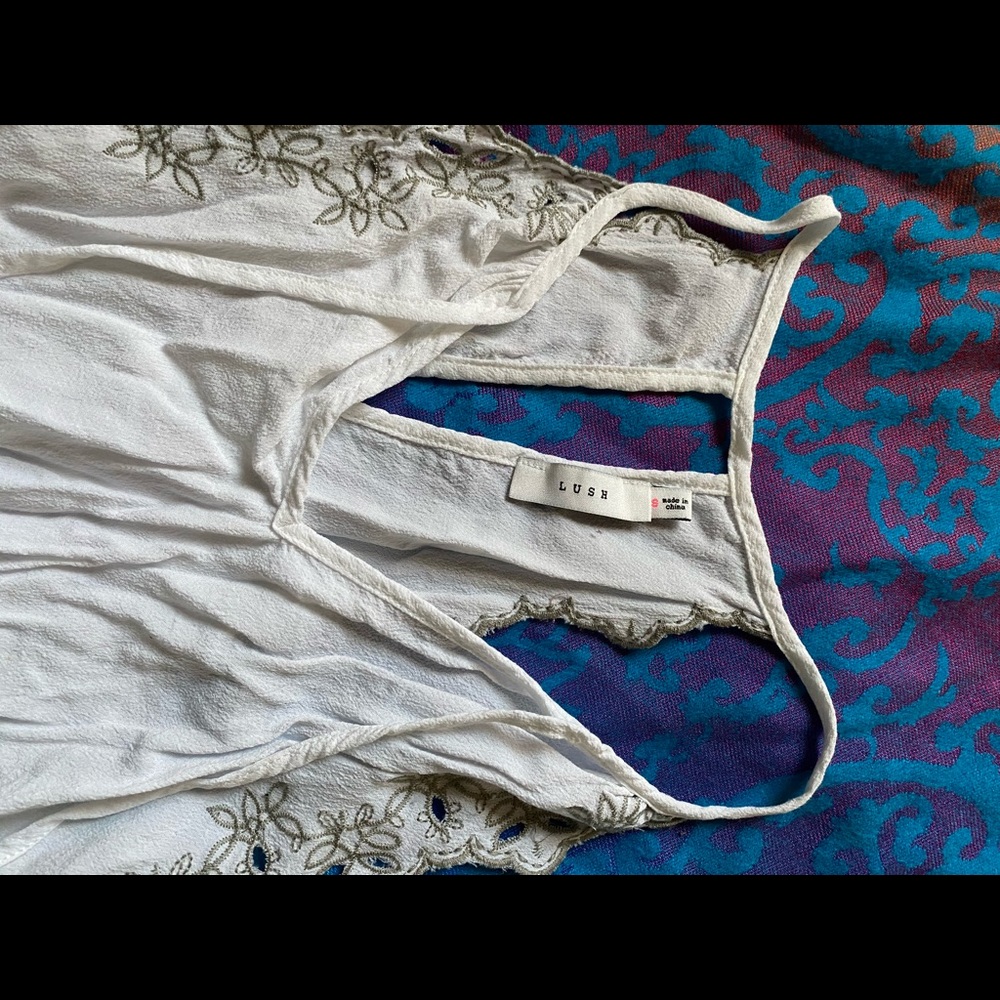 Light off white blouse with decorative stitching